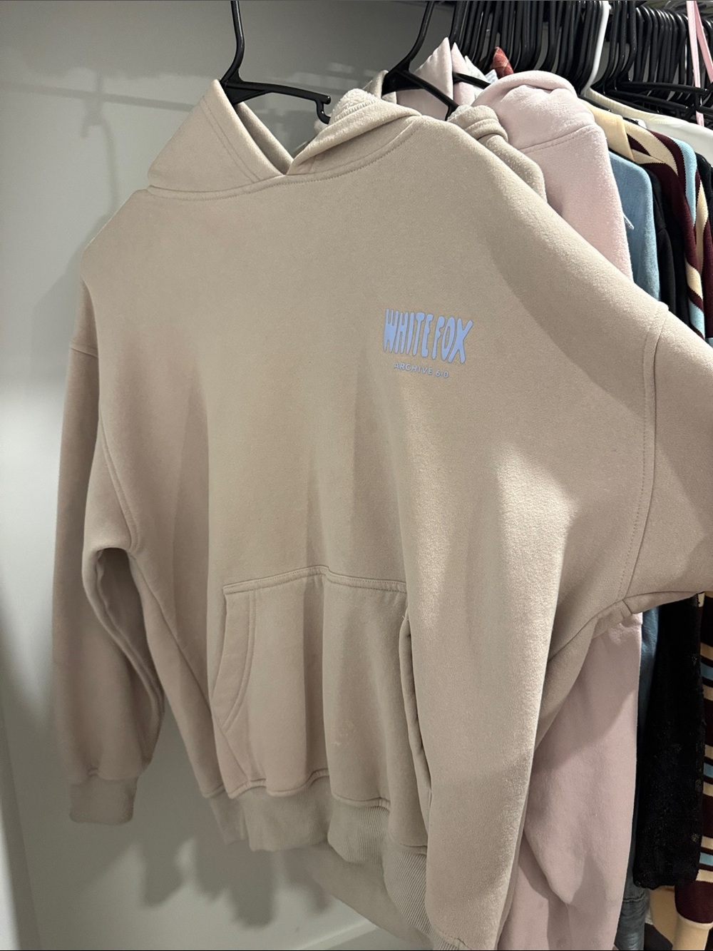 White Fox Boutique Beige Hoodie with Light Blue Logo